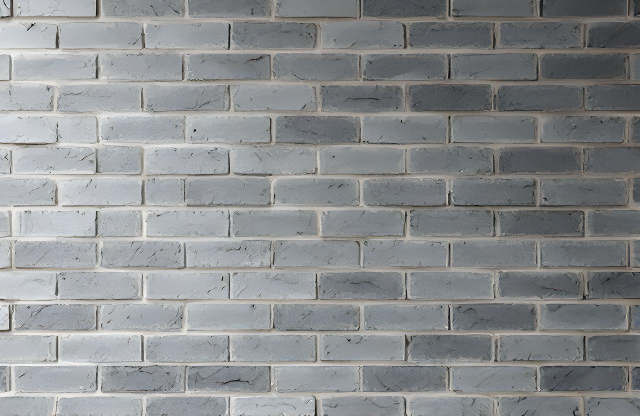 Pared de ladrillos en obra con textura gris suave y luz lateral natural